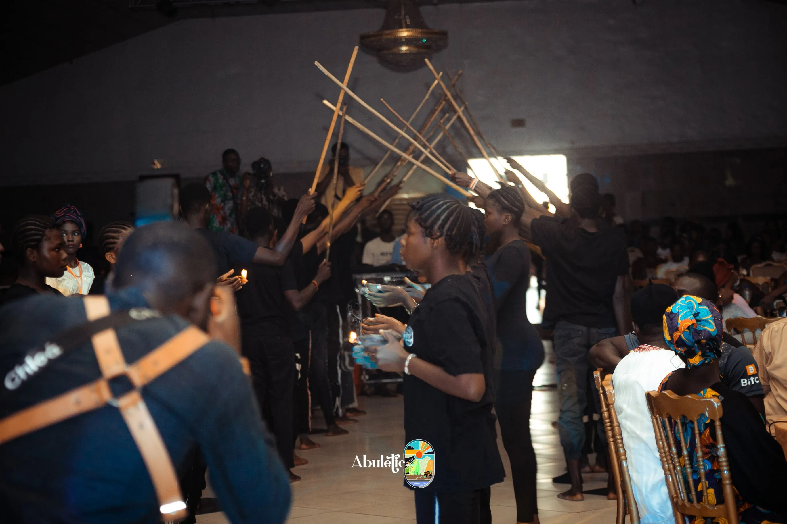 The procession under an arch of raised sticks