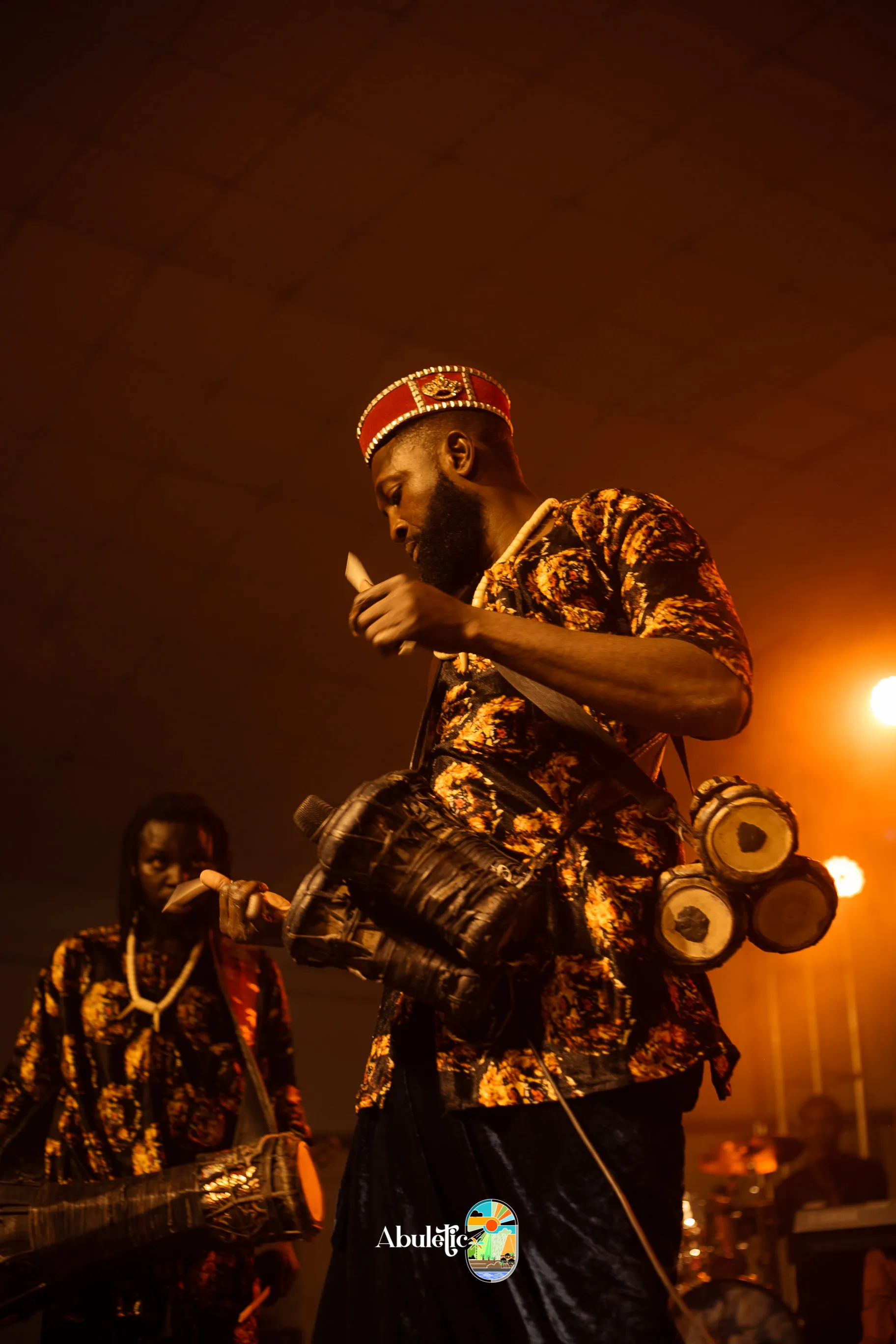The drummer, in amber light