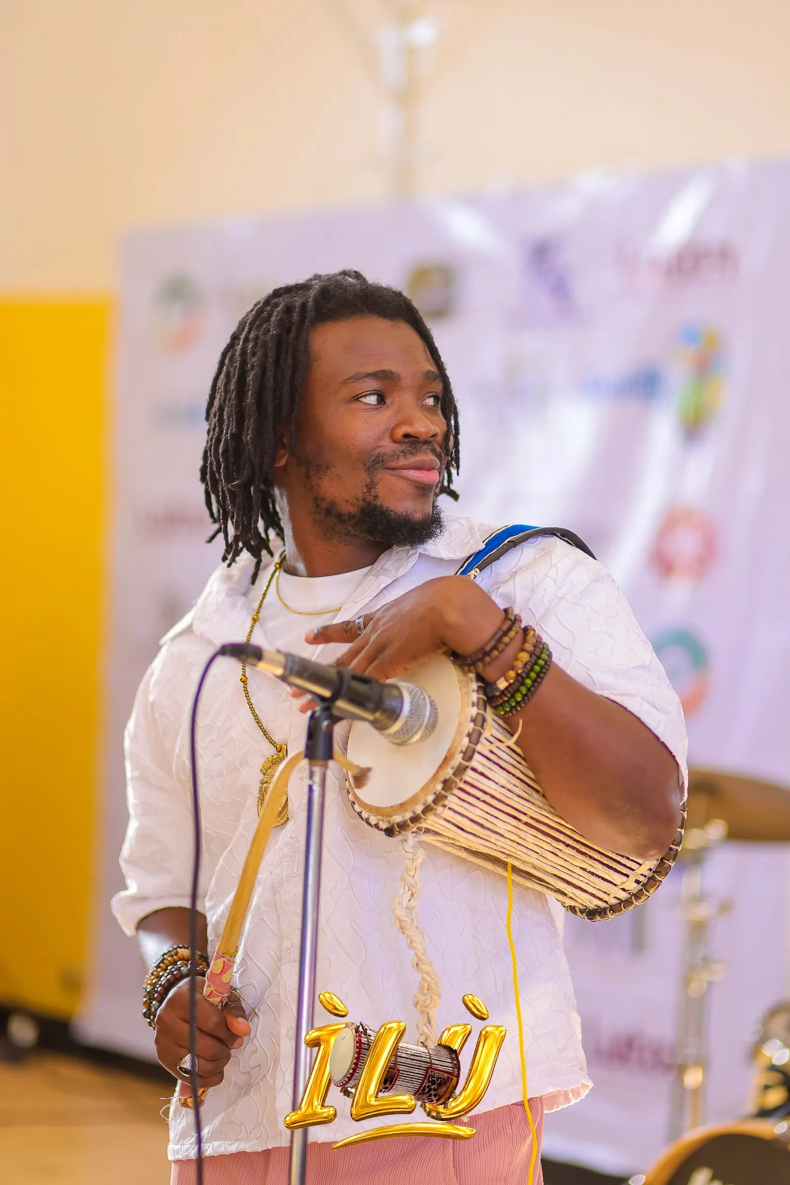Tuning up the talking drum