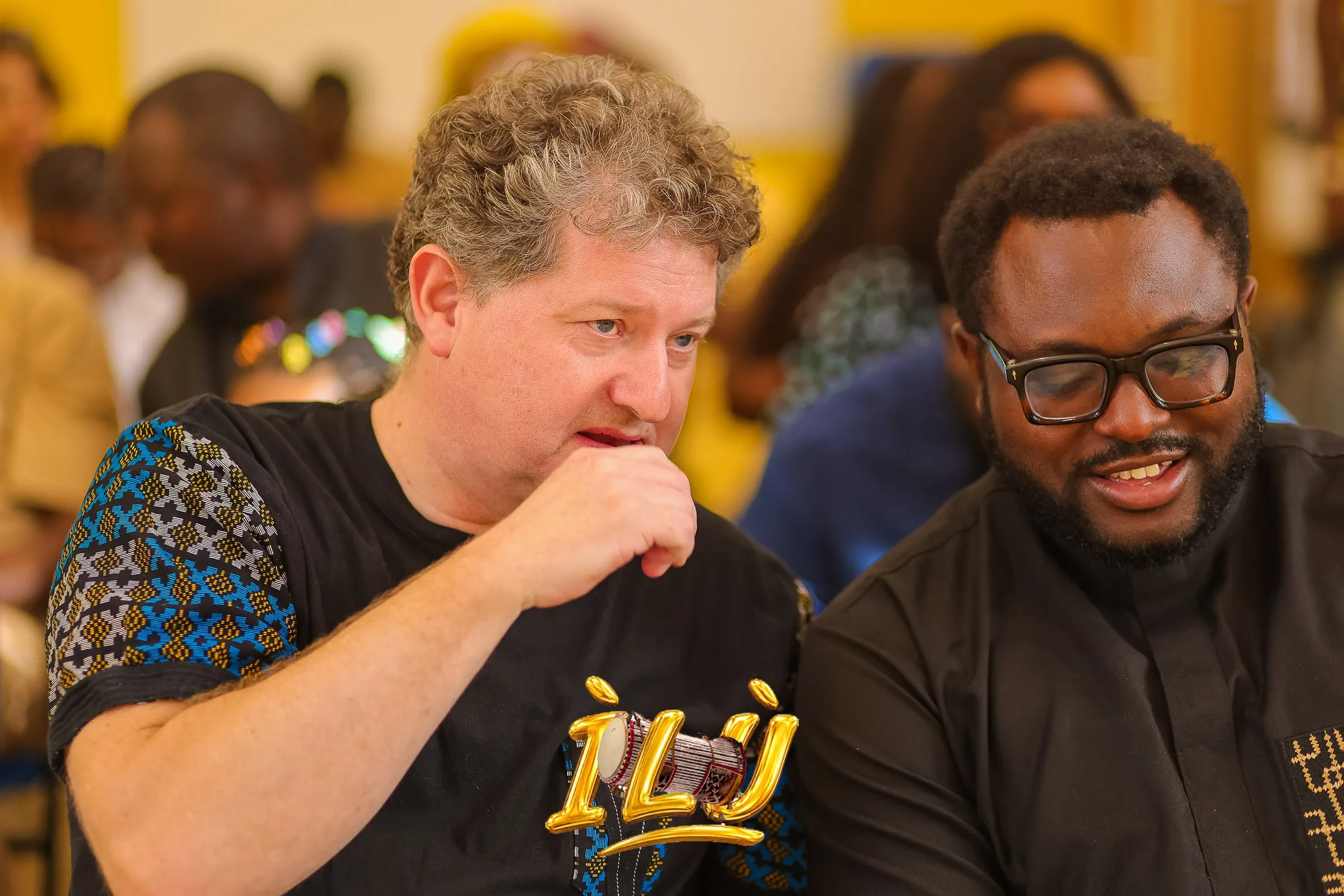 Guests in conversation between the acts