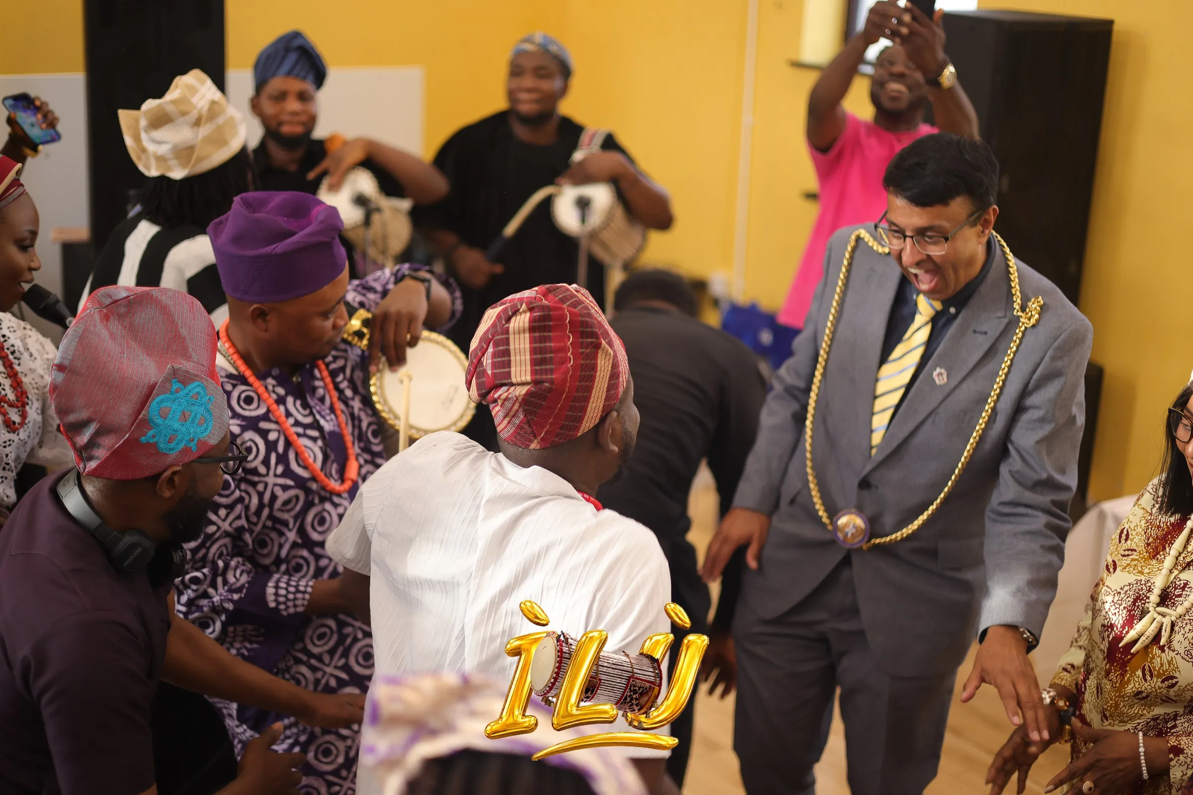 The Mayor of Luton, in his chain of office, joins the dance