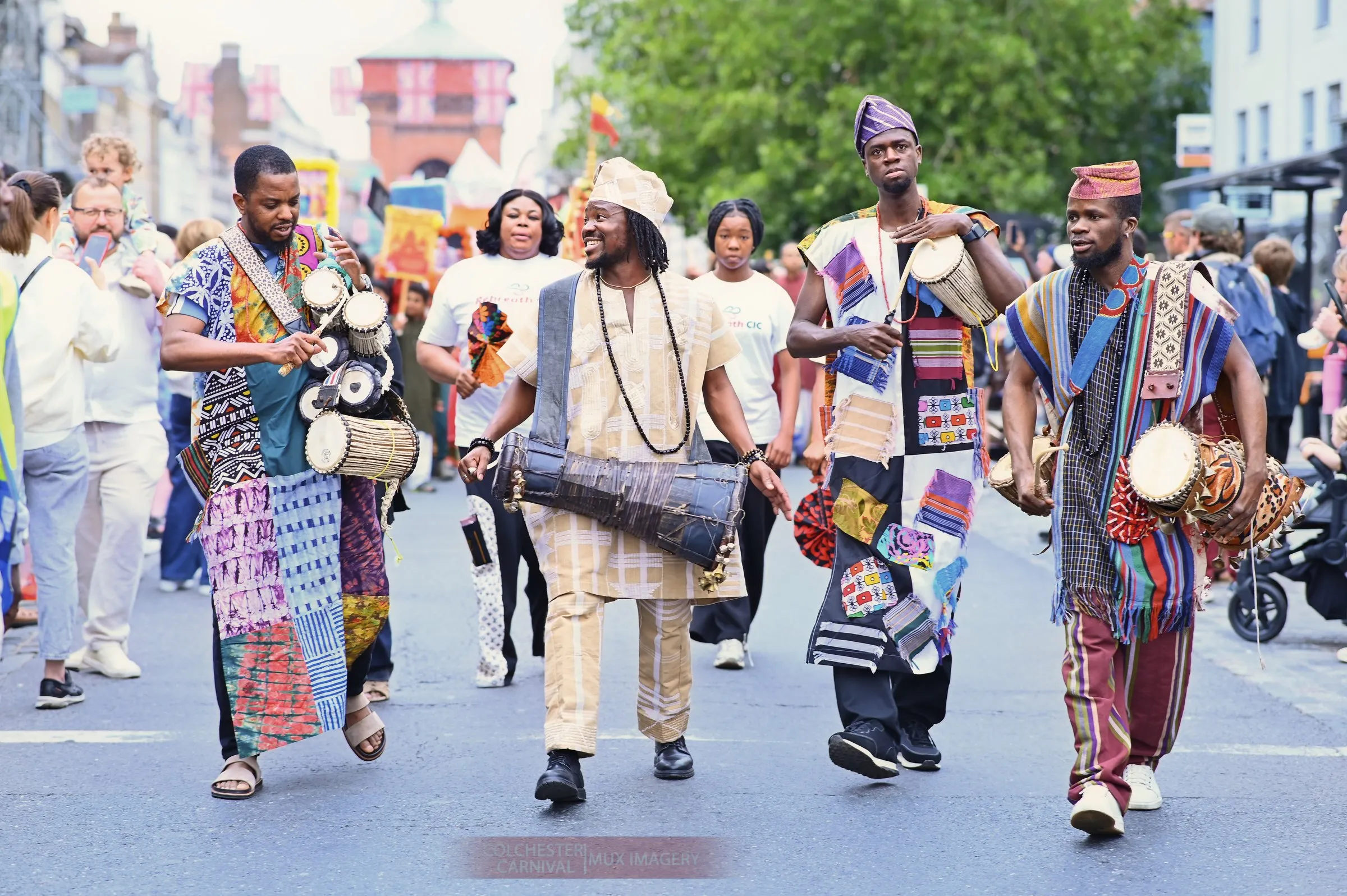 The Abuletic drummers walk the parade route at Colchester Carnival